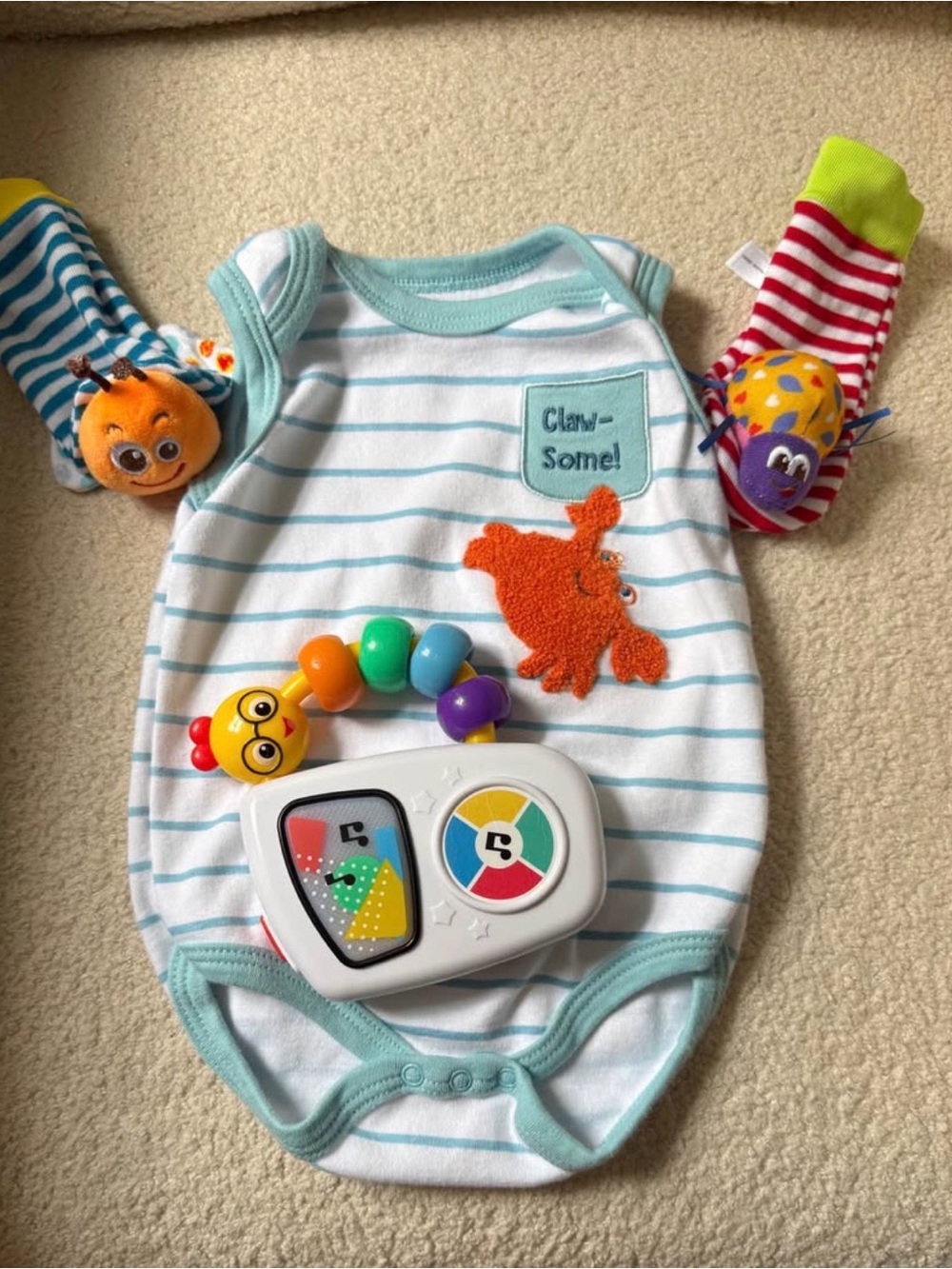 Striped Crab Baby Onesie with Teal Trim and Colorful Toy Set